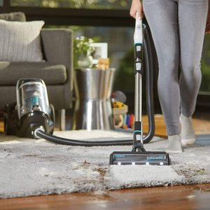 Bissell SmartClean Pet Vacuum Cleaner in use.