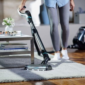 Bissell SmartClean Pet Vacuum Cleaner in use.