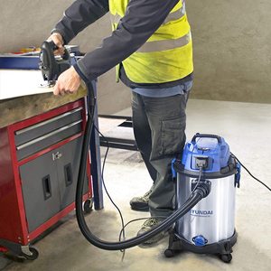 Hyundai Wet and Dry Vacuum Cleaner connected to a power tool.