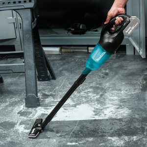 Makita DCL180ZB Vacuum Cleaner in use.