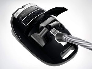 Miele Complete C3 Score Powerline Vacuum Cleaner's integrated attachments.