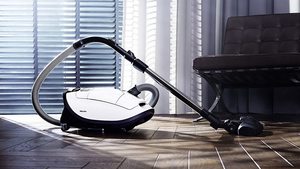 Miele Complete C3 Silence Vacuum Cleaner on its front.