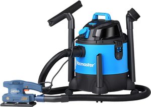 Vacmaster Wet and Dry Vacuum Cleaner connected to a power tool.